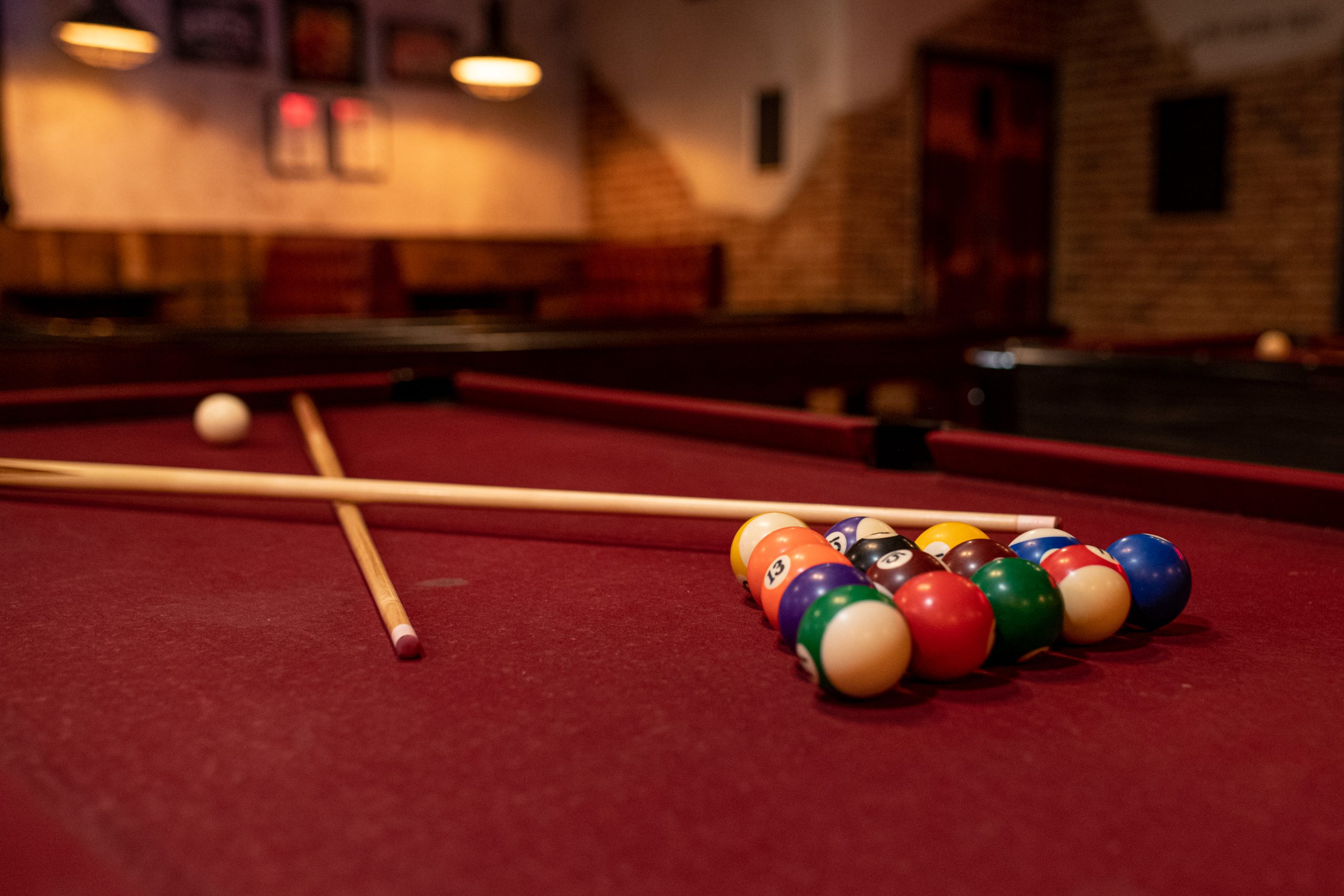Enjoy a game of pool with friends at Firepit bars